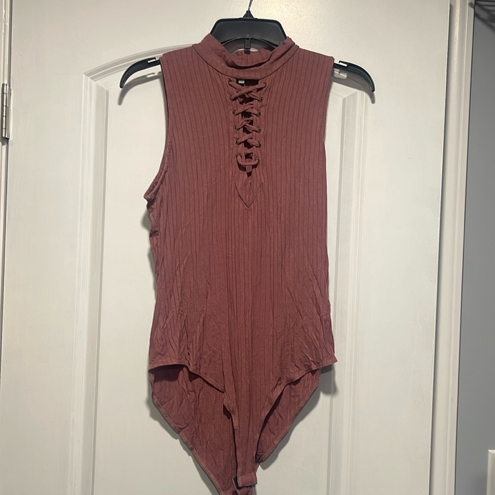 Pink turtle neck lace up leotard